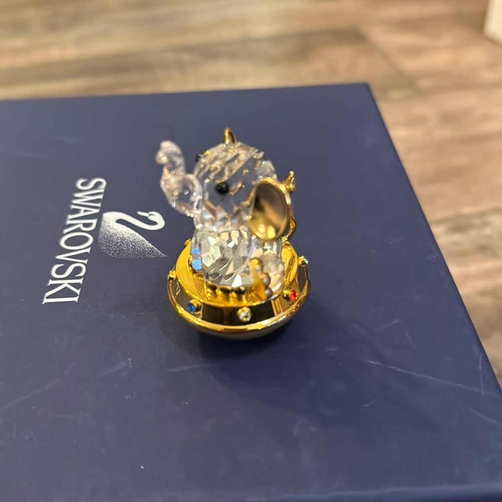 Swarowski mint condition elephant with gold ears.